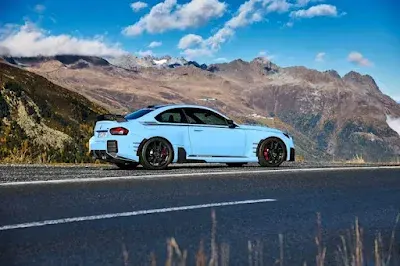 Image of BMW M2 cuptured on the Sideway of the road
